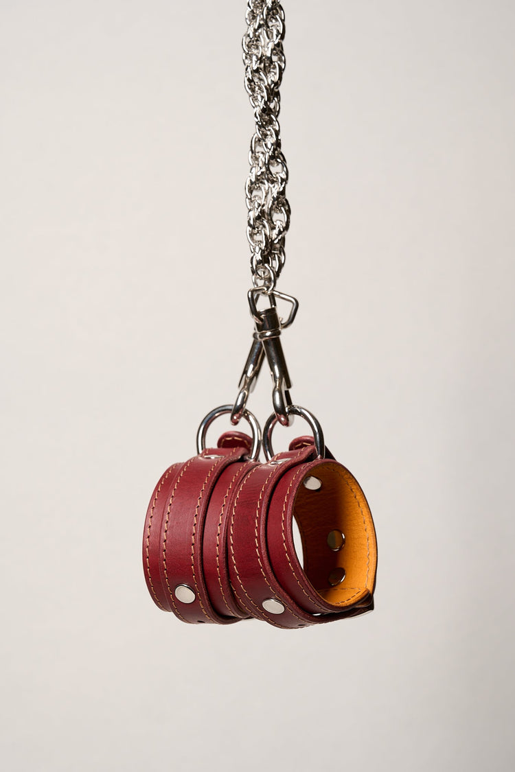 burgundy writs cuffs with silver hardware