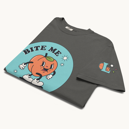 1920's animated peach t-shirt in gray "bite me" in bold letters, lovey subby logo on left arm sleeve