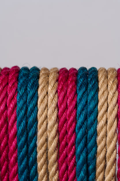 Close-up of multicolored ropes on a light gray background