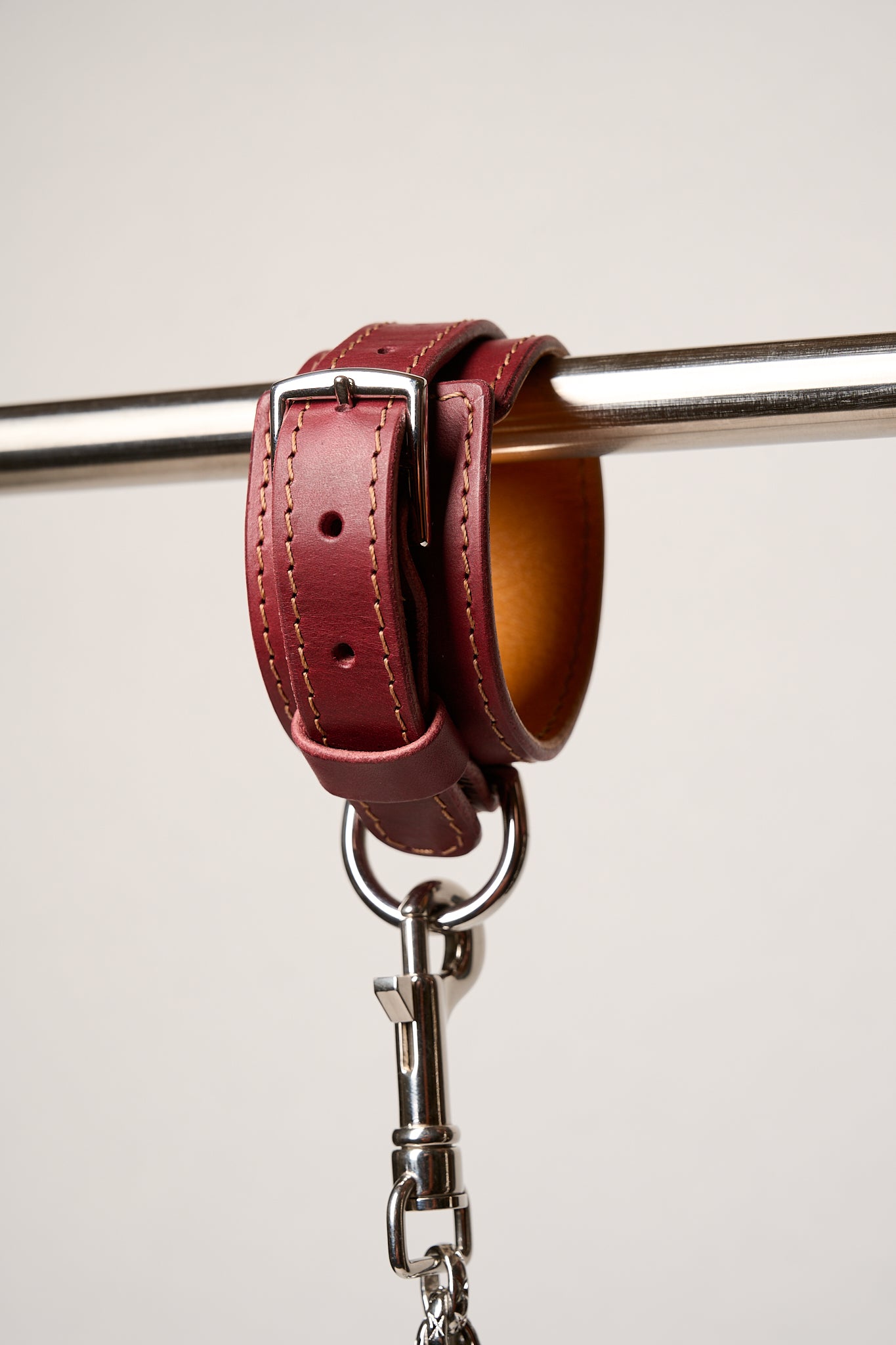 Burgundy leather cuff with silver hardware