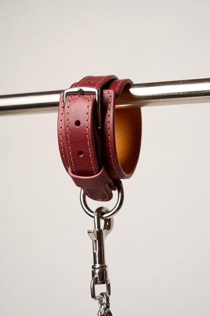 Burgundy leather cuff with silver hardware