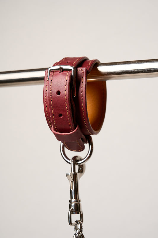 Burgundy leather cuff with silver hardware